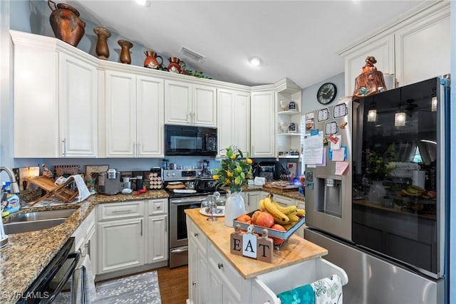 kitchen featuring white cabinetry, appliances with stainless steel finishes, and a sink