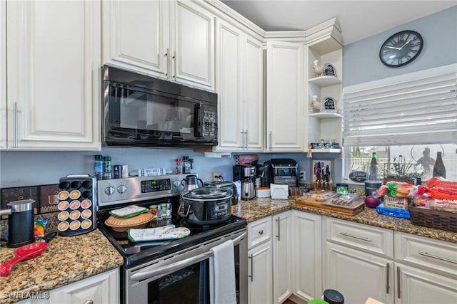 kitchen featuring light stone counters, open shelves, stainless steel range with electric cooktop, white cabinets, and black microwave