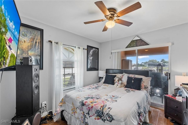 bedroom featuring access to exterior and ceiling fan