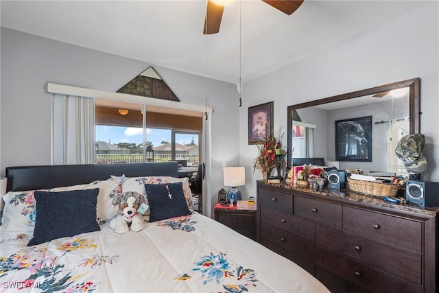 bedroom with lofted ceiling and a ceiling fan