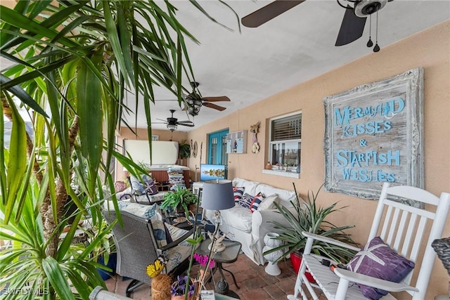 view of patio featuring a ceiling fan