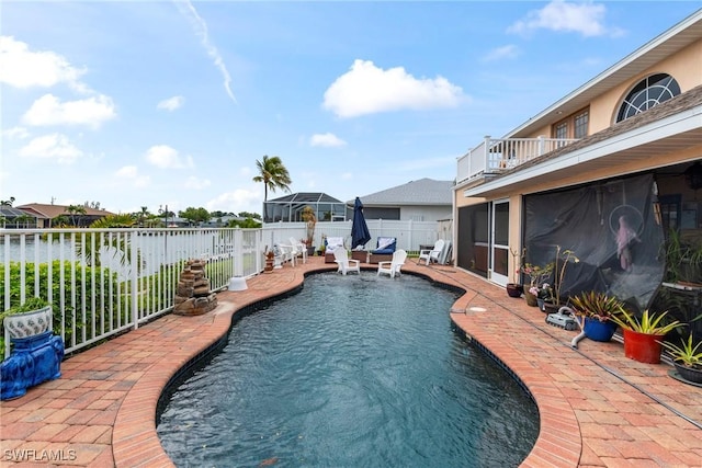 view of pool featuring a fenced in pool, a fenced backyard, and a patio area