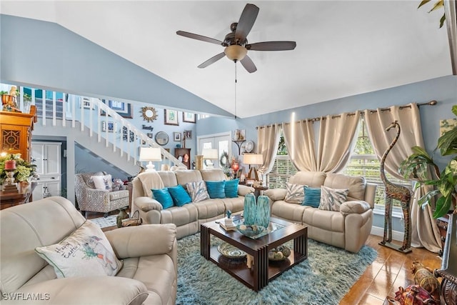 tiled living area with stairs, lofted ceiling, french doors, and ceiling fan