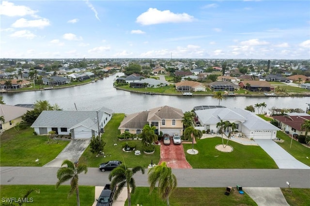 aerial view with a residential view and a water view