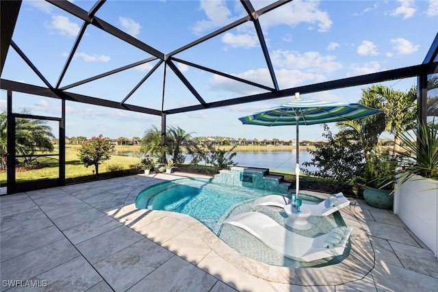 outdoor pool featuring glass enclosure, a patio, a water view, and a jacuzzi