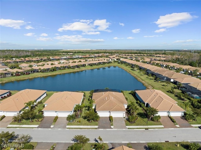 bird's eye view featuring a water view and a residential view