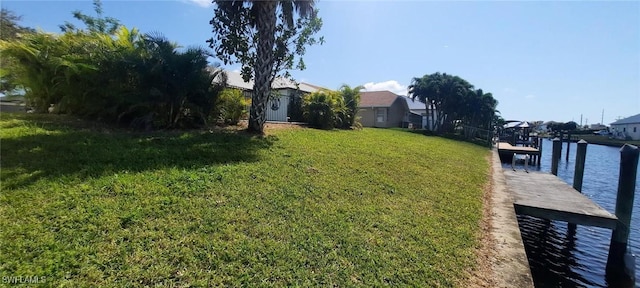 view of yard with a boat dock