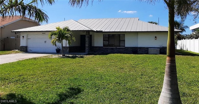 view of front of property featuring stone siding, an attached garage, fence, and stucco siding