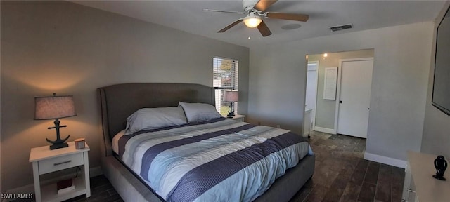 bedroom with baseboards, visible vents, ceiling fan, and dark wood-style flooring