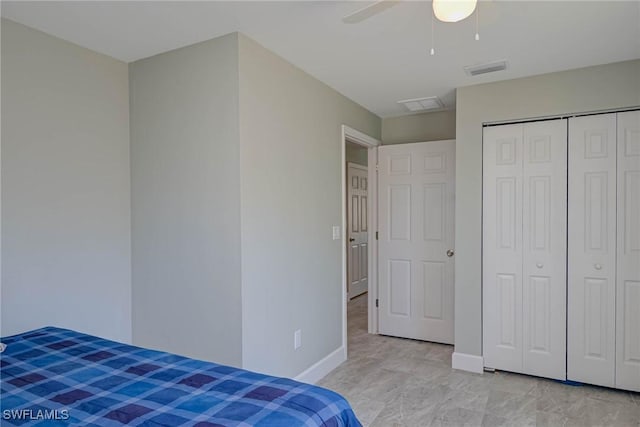 bedroom featuring visible vents, baseboards, a closet, and ceiling fan