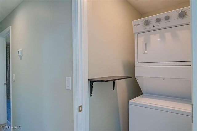 laundry room featuring laundry area and stacked washing maching and dryer