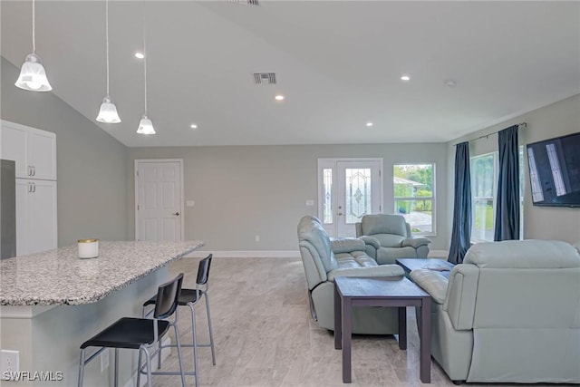 living area featuring visible vents, recessed lighting, lofted ceiling, and baseboards