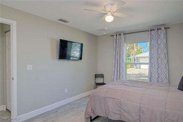 bedroom featuring baseboards, visible vents, and ceiling fan