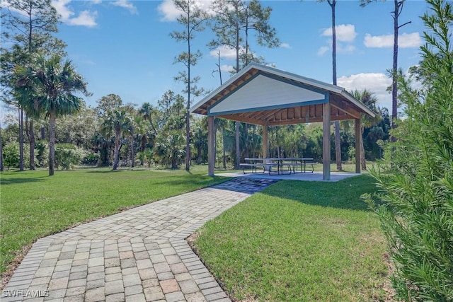 surrounding community with a gazebo and a lawn