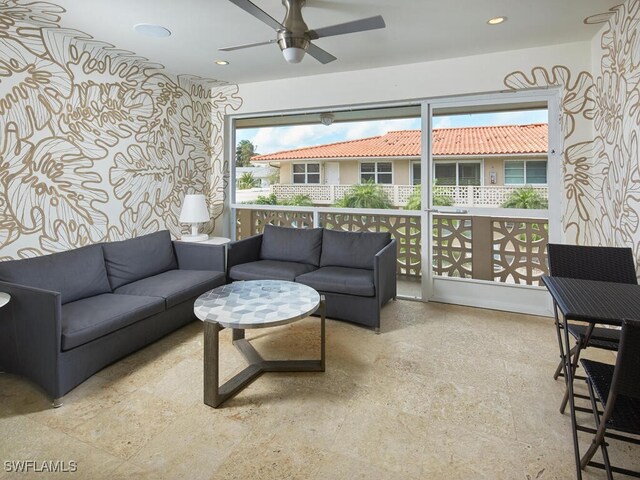 living room with wallpapered walls, ceiling fan, and recessed lighting