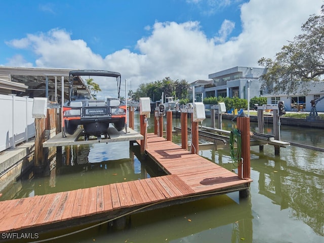 dock area featuring a water view and boat lift