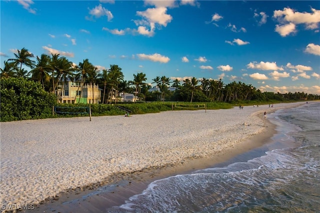 view of road with a beach view and a water view