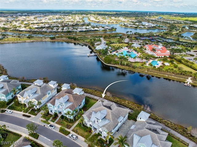 aerial view featuring a residential view and a water view