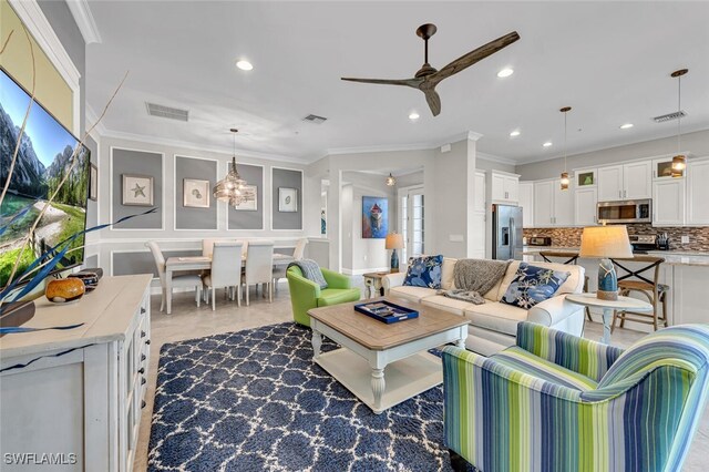 living area with ornamental molding, visible vents, and recessed lighting