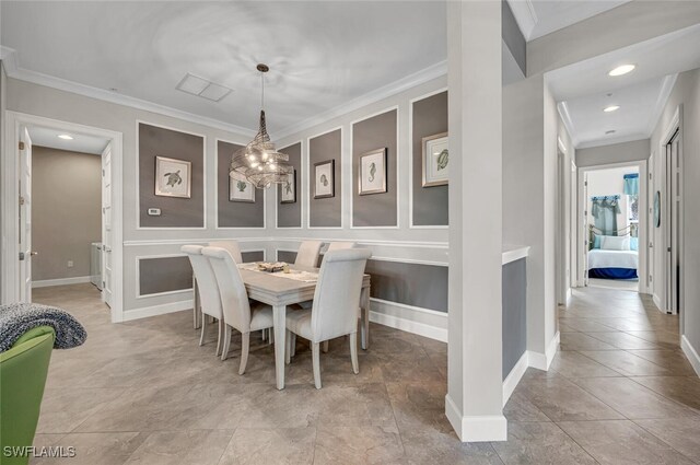 tiled dining area with a notable chandelier, recessed lighting, baseboards, and crown molding