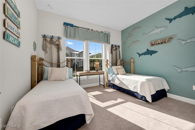 bedroom with carpet and baseboards