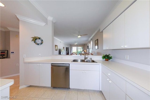 kitchen featuring ornamental molding, light countertops, dishwasher, and a sink