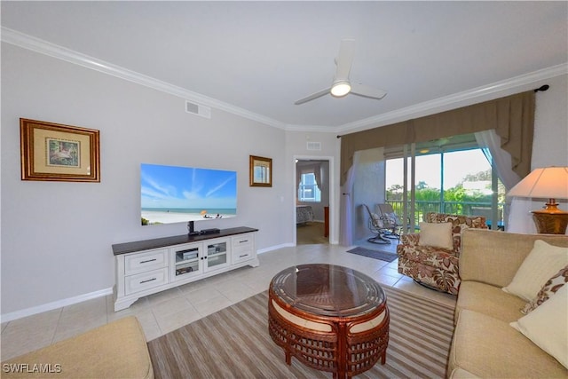 living area featuring ornamental molding, light tile patterned flooring, and visible vents