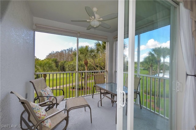 sunroom with a ceiling fan