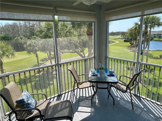 sunroom / solarium with a water view