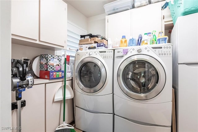 laundry area featuring cabinet space and independent washer and dryer