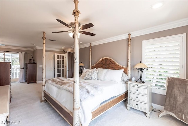 bedroom featuring a ceiling fan, baseboards, crown molding, and light colored carpet