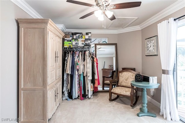 sitting room with baseboards, ornamental molding, and light colored carpet