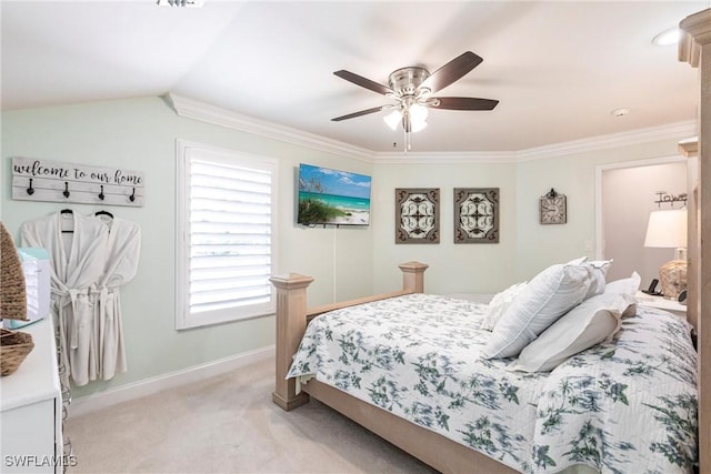 bedroom featuring crown molding, lofted ceiling, light colored carpet, ceiling fan, and baseboards