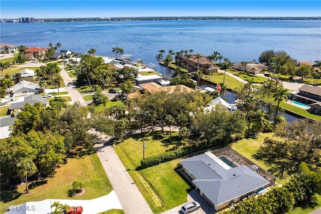 aerial view featuring a residential view and a water view