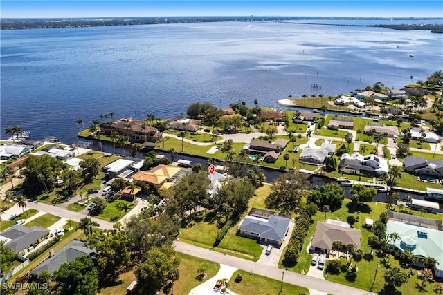 bird's eye view featuring a residential view and a water view