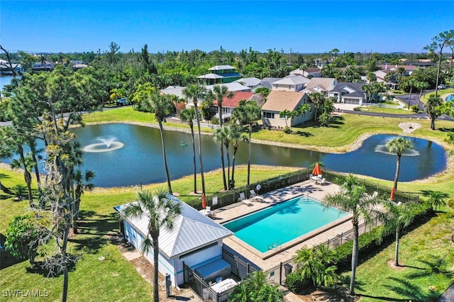 drone / aerial view featuring a water view and a residential view