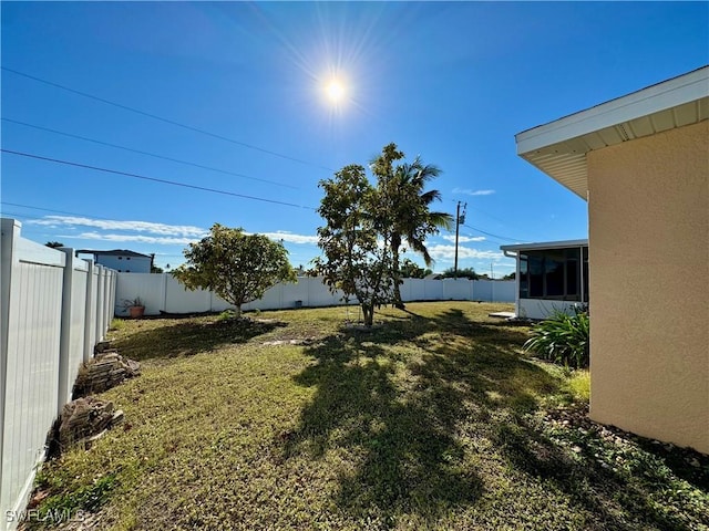 view of yard with a fenced backyard