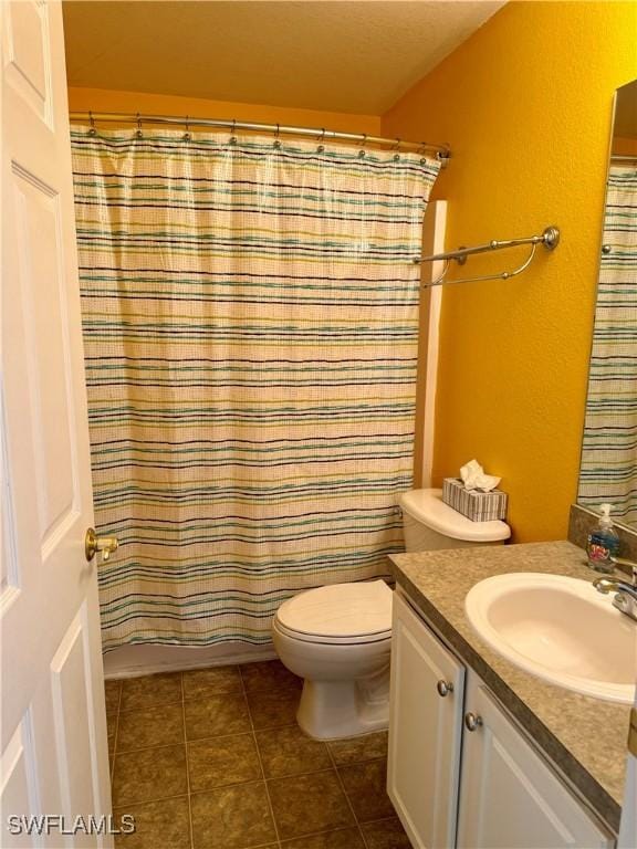 full bathroom with toilet, a shower with curtain, tile patterned flooring, and vanity