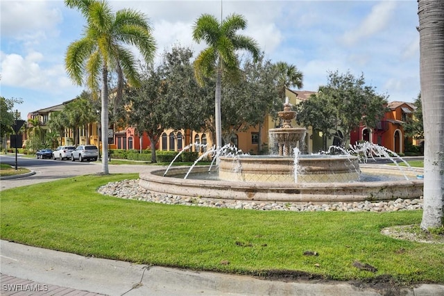 surrounding community featuring a residential view and a lawn