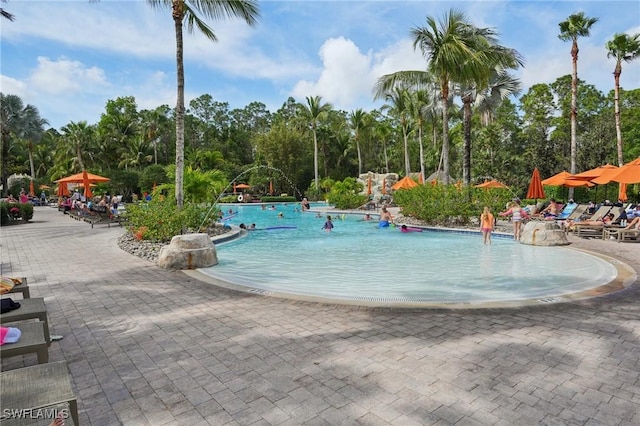 community pool featuring a patio area