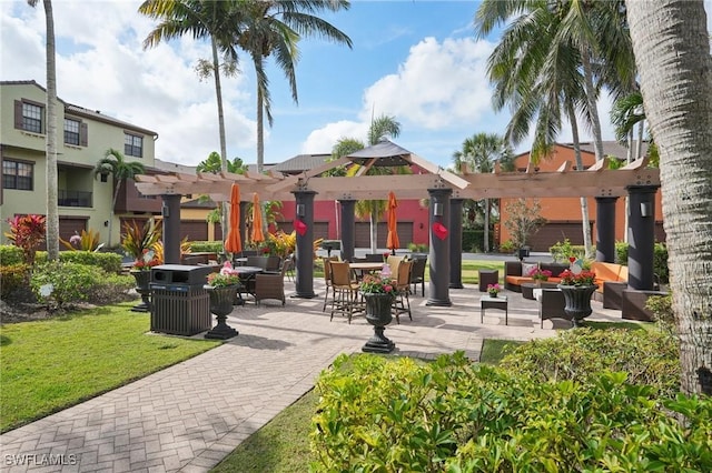 view of home's community with a patio, a yard, and a pergola