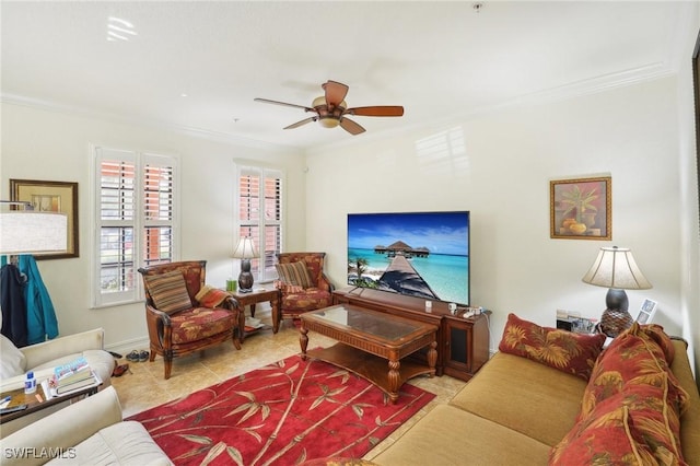 living room featuring a ceiling fan, crown molding, and tile patterned floors