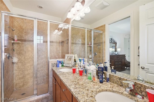 full bathroom with a sink and a shower stall