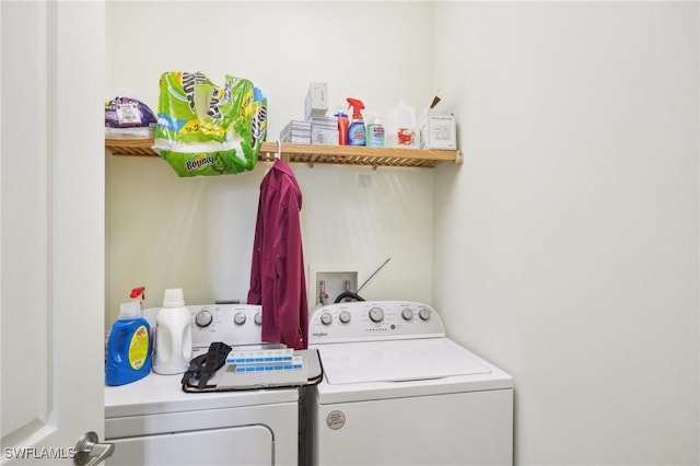 washroom featuring laundry area and washing machine and clothes dryer