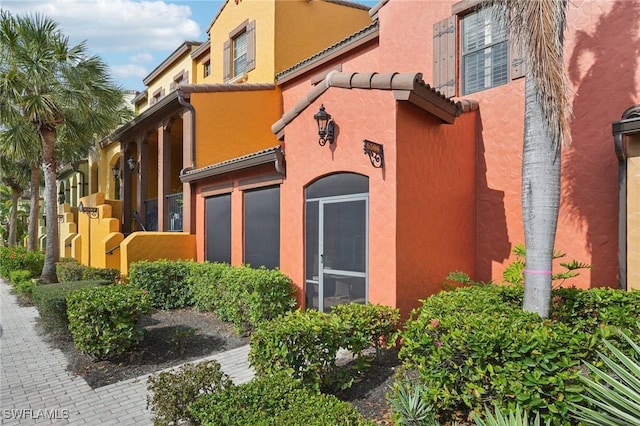 view of side of home featuring stucco siding