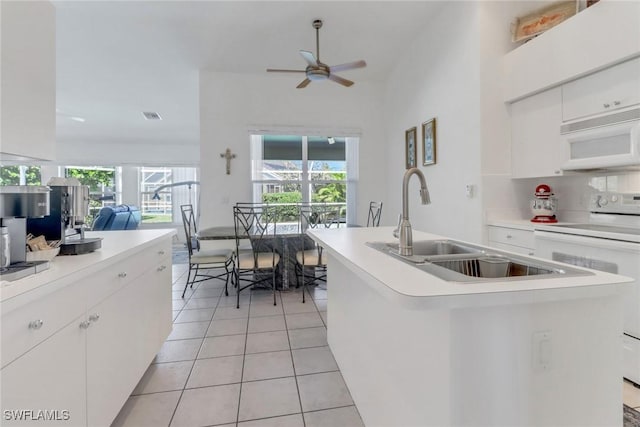 3650 Sunland Ln, Estero, FL 33928 - kitchen featuring white appliances, white cabinetry, light countertops, a ceiling fan, and light tile patterned floors