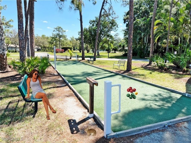 3650 Sunland Ln, Estero, FL 33928 - view of home's community with a game area and a lawn