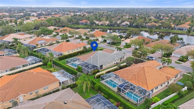 aerial view with a residential view and a water view