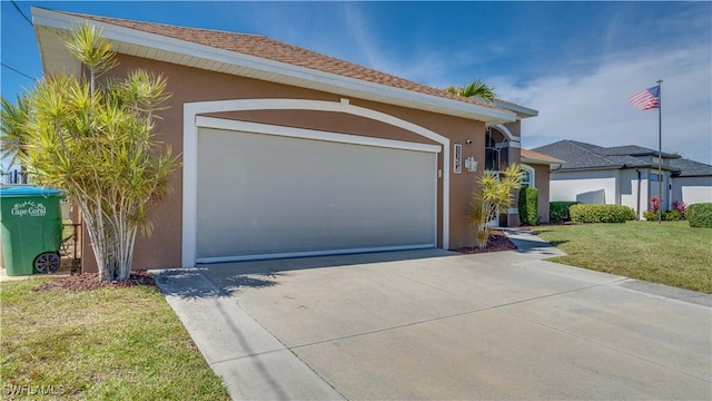 view of front of property with a garage, concrete driveway, roof with shingles, stucco siding, and a front lawn