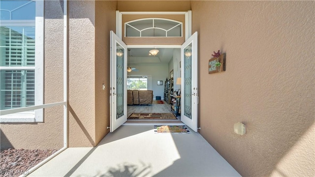 property entrance featuring stucco siding